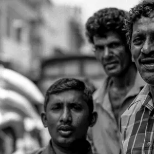 Three men chatting by wayside