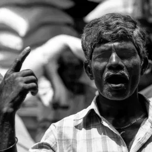 Man shouting with pointing at sky