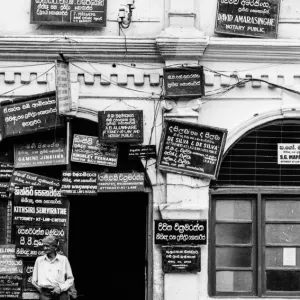 Many signboards hung on the wall