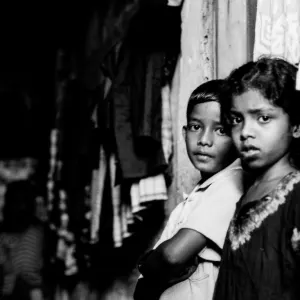 Boy and girl standing in dimness