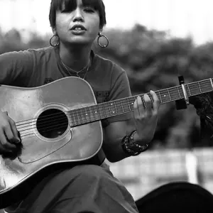 Woman playing guitar