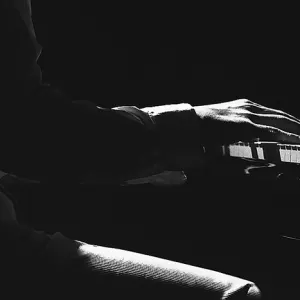 Hand playing piano