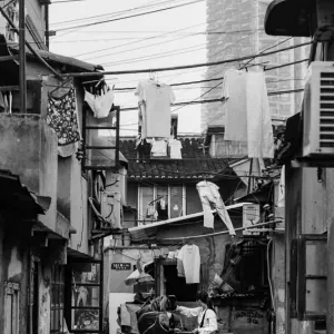 Woman standing in deserted lane