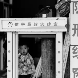 Boy standing in frame