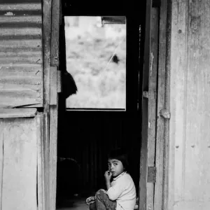 Girl pouting at the door