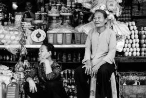 Two older women sitting in storefront