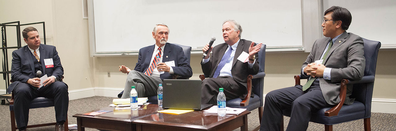 Mr. Brown is answering a question from audience at North Korean discussion event.