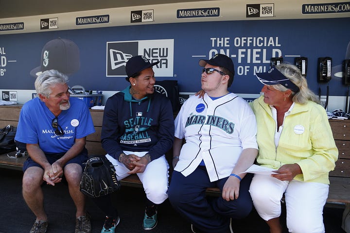 Randy Martin and his family chatting with Felix Hernandez.