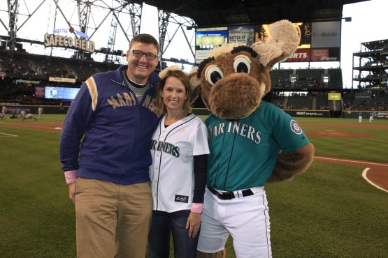 Mariners 2012 Honorary Bat Girl Nancy Haunty, with her husband Jake and the Mariners Moose, before her ceremonial first pitch.