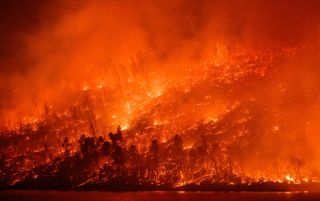 The Thompson fire burns around Lake Oroville in Oroville, California on July 2, 2024.