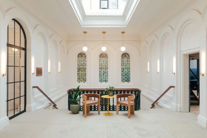 Walworth Town Hall by feix and merlin for GeneralProjects with its white, historical interior and tall ceilings