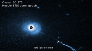 A Hubble Space Telescope image of the core of quasar 3C 273. A coronagraph on Hubble blocks out the glare coming from the supermassive black hole at the heart of the quasar.