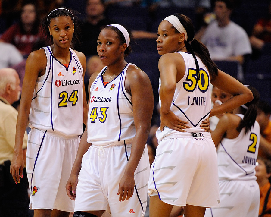 Disappointed Phoenix Mercury players Bonner, Willingham and Smith watch as their team loses to the Minnesota Lynx. Phoenix, AZ July 22, 2009. Photo by Max Simbron