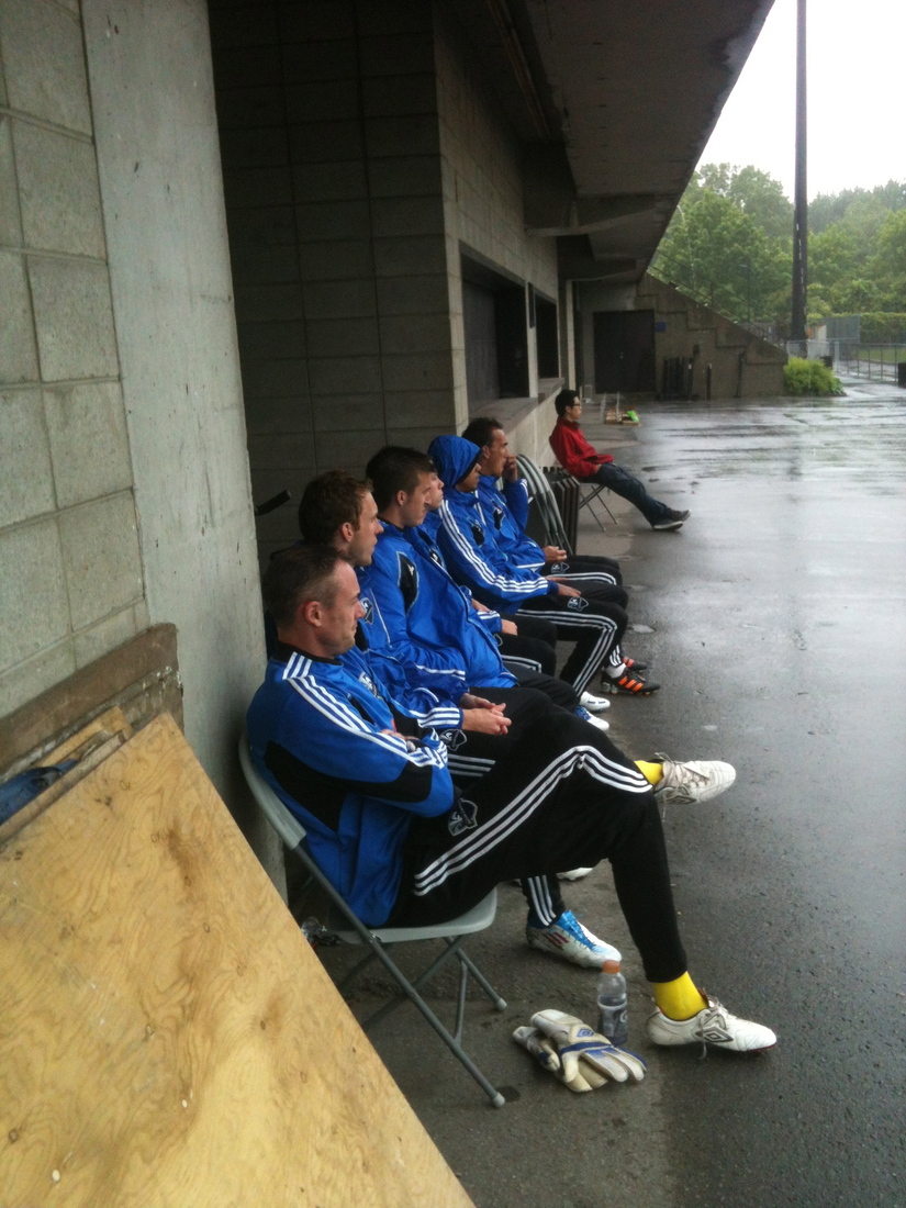 The Montreal Impact bench watch their teammates play in the confort of a dry spot at Complexe Sportif Claude Robillard.