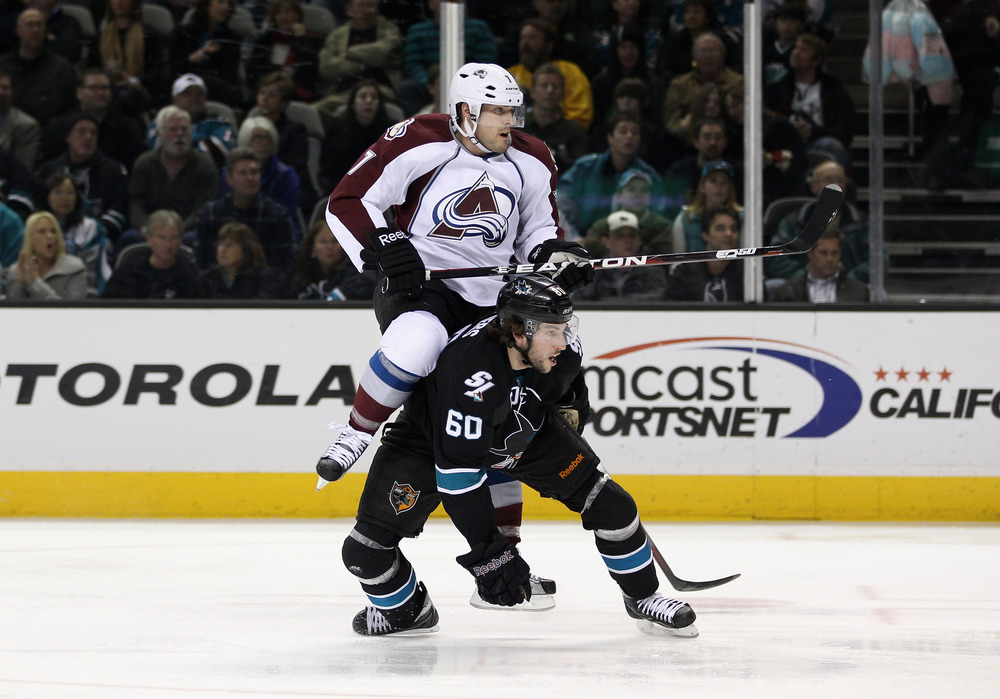 SAN JOSE, CA - DECEMBER 15:  Jason Demers #60 of the San Jose Sharks collides with David Van Der Gulik #7 of the Colorado Avalanche at HP Pavilion at San Jose on December 15, 2011 in San Jose, California.  (Photo by Ezra Shaw/Getty Images)