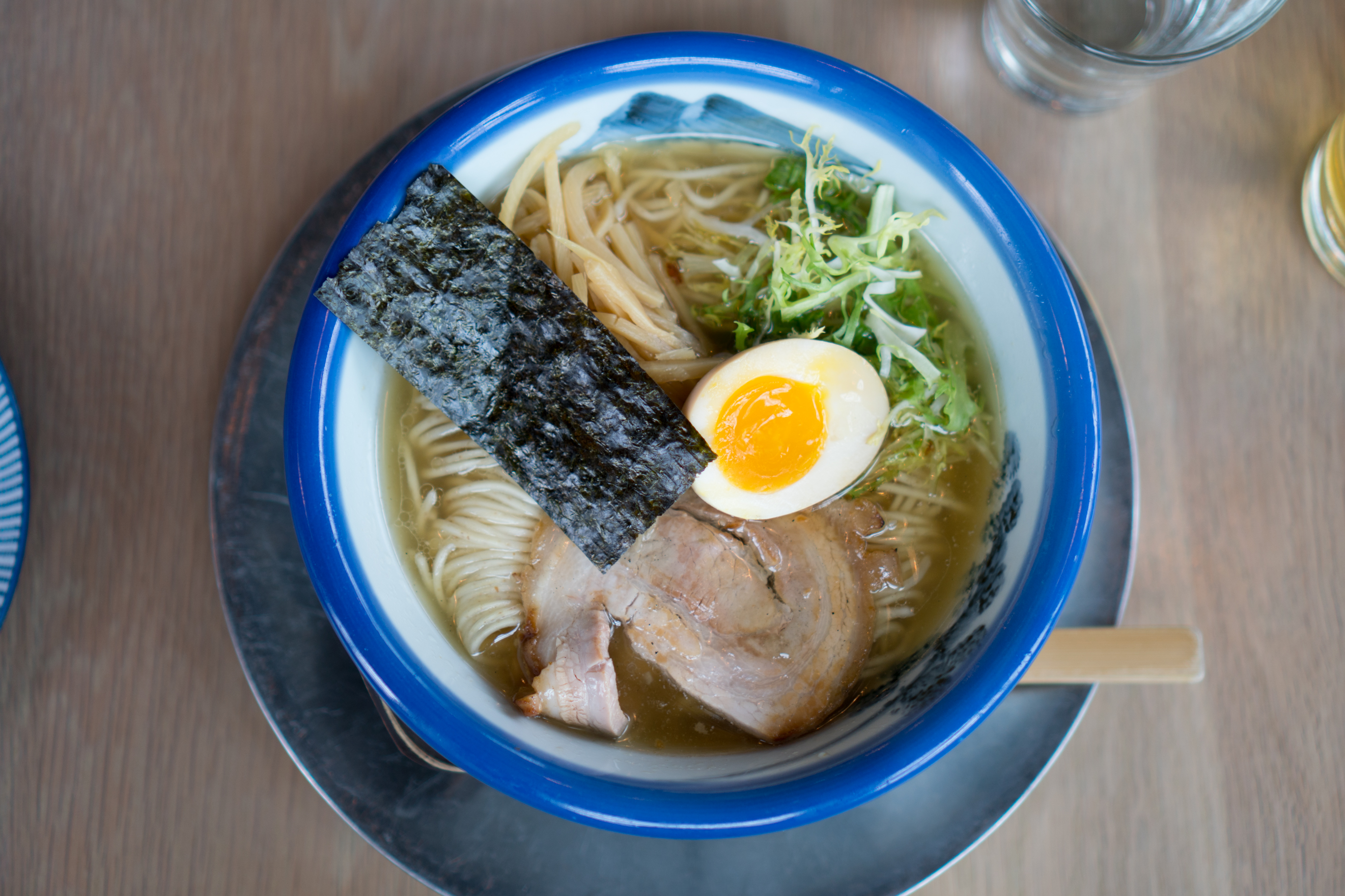 A ramen bowl at Afuri with a soft-boiled egg, chashu pork, and a piece of nori.