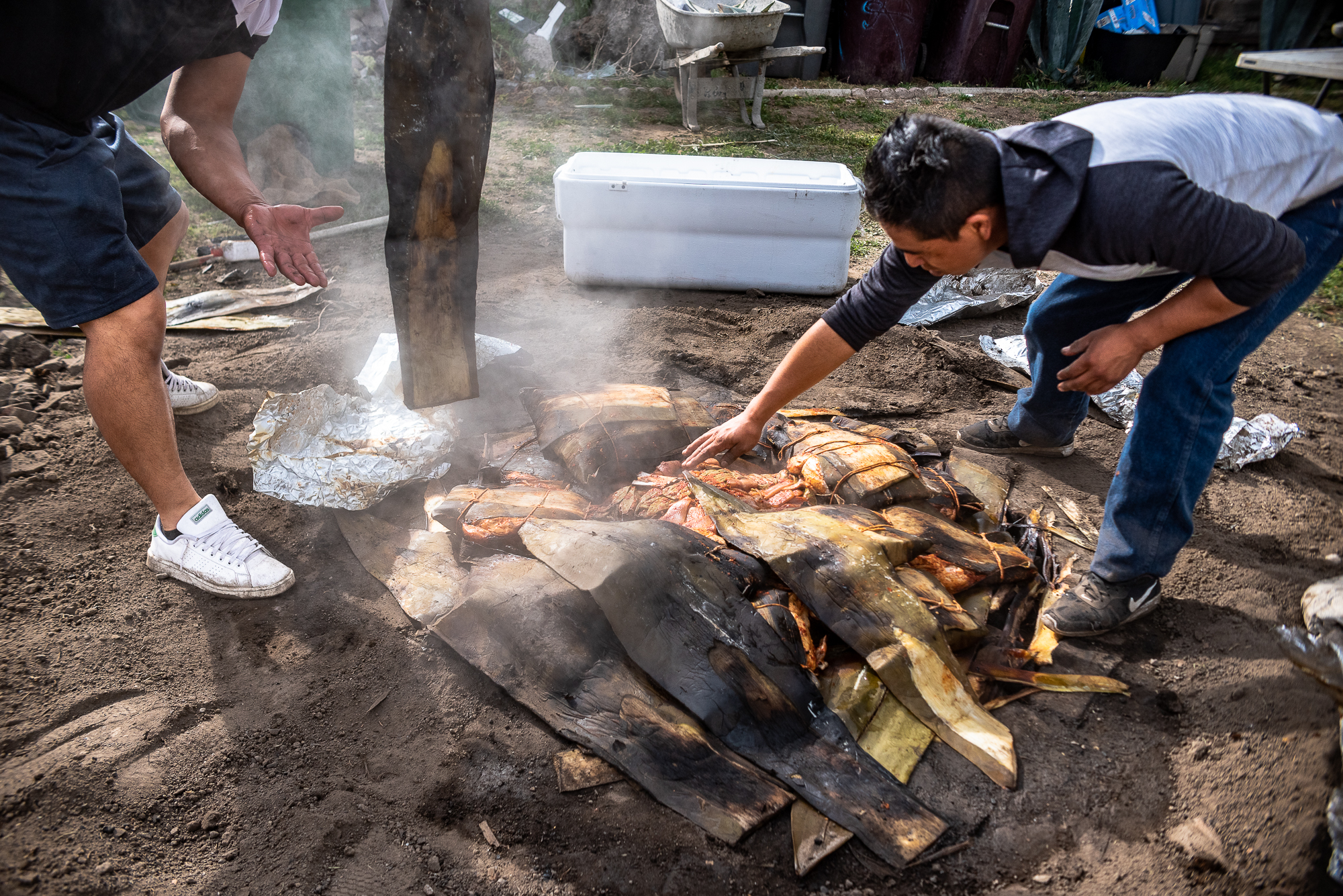 Preparing the underground barbacoa pit.