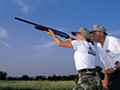 Woman learning to shoot