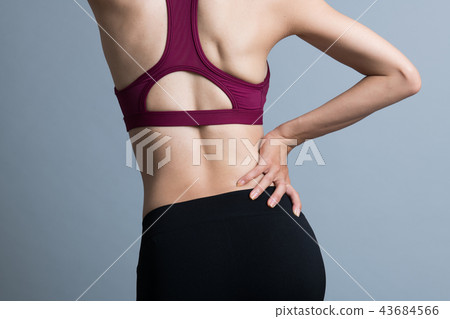 Young Japanese woman athlete with low back pain 43684566