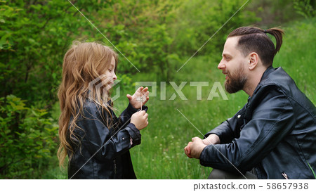 Dad and daughter spend time together in park 58657938