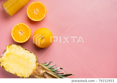 Ripe juicy fresh tropical fruits, on pink textured summer background, top view flat lay, with copy space for text 79152953