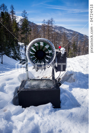 Snow gun in a ski resort 84724418