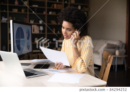 Focused African American business woman working from home 84294252