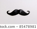 Black moustache shape paper die cut selfie portrait party fun paper prop sticker stick on white background  85478981