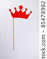 Red crown shape paper die cut selfie portrait party fun paper prop sticker stick on white background  85478982