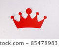 Red crown shape paper die cut selfie portrait party fun paper prop sticker stick on white background  85478983