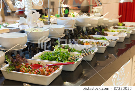 Variety of fresh salads in a buffet. Concept of all inclusive hotel or healthy eating 87223033