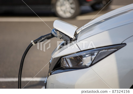 Electric vehicle charging at the charging station 87324156