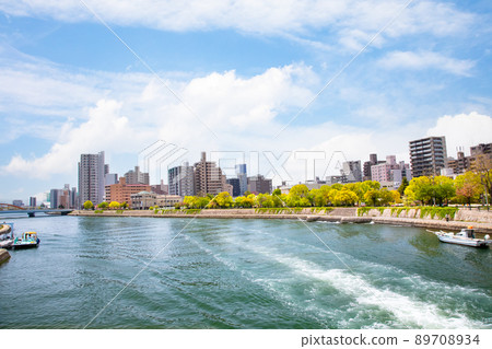 View toward Kawaramachi and Funairimachi along the main river of Hiroshima City. It is a wake of a pleasure boat sailing in front of Aster Plaza. Hiroshima 89708934