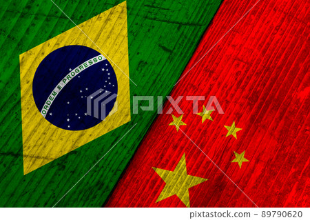 Flags of Brazil and China on a wooden surface. 89790620