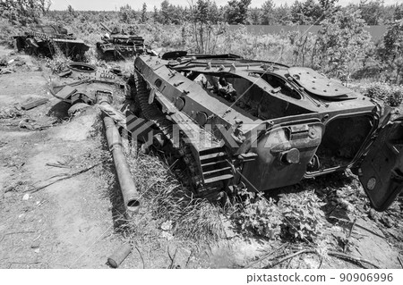 Destroyed military equipment during the war in Ukraine, black and white photo 90906996