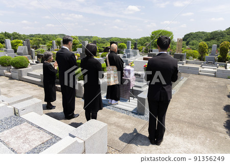 Bereaved family attending the bone-laying ceremony 91356249