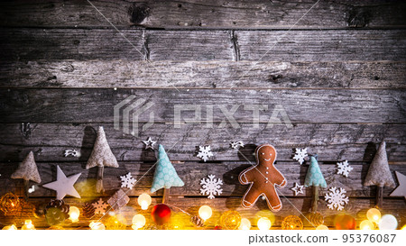 Christmas Still Life with Old Wooden Background and Snowflakes Falling 95376087