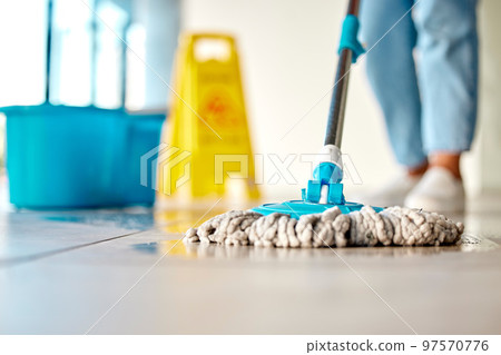 Mop, cleaner and washing wet floor for hygiene, disinfection or sanitary area for cleanliness at the workplace. Housekeeper cleaning dirty flooring for sanitization, water or wash indoors 97570776