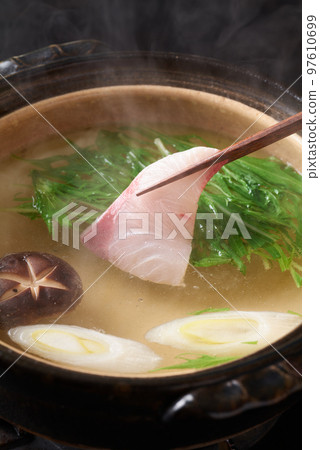 Yellowtail fillets submerged in hot water: yellowtail shabu 97610699