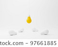 Hanging light bulb yellow outstanding among lightbulb group 97661885