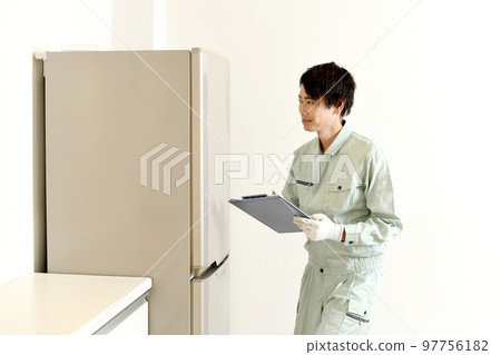 Male worker checking the refrigerator 97756182