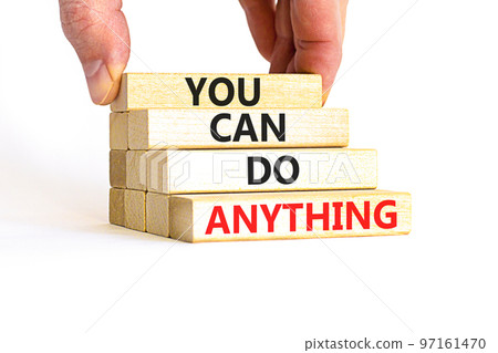 You can do anything symbol. Concept word You can do anything on wooden blocks. Businessman hand. Beautiful white table white background. Business and you can do anything concept. Copy space. 97161470