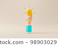 Hand holding lightbulb on background 98903029