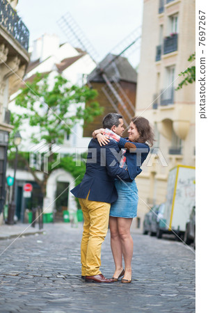 Couple kissing in Paris on Montmartre 7697267