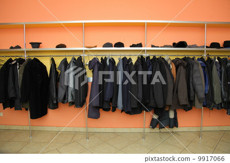 Many clothes in cloakroom 9917066