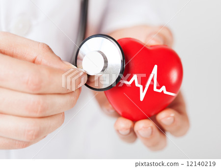 doctor hands holding red heart and stethoscope 12140219