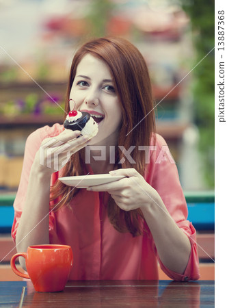 Style redhead girl with cake and cup 13887368