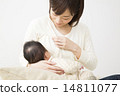 Mother holding a baby 14811077