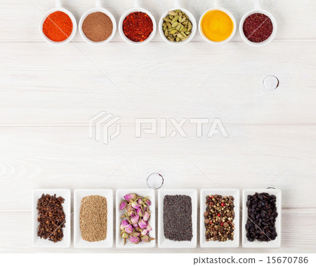 Various spices on white wooden background 15670786