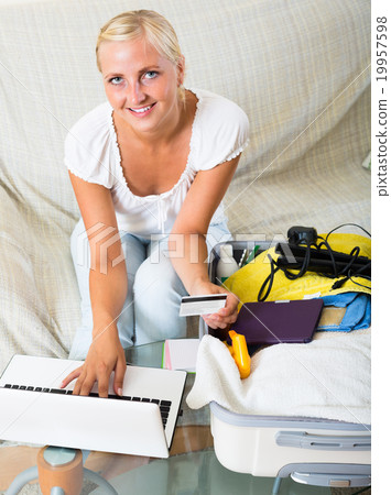 Girl with credit card and laptop. 19957598